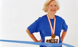 older woman finishing race
