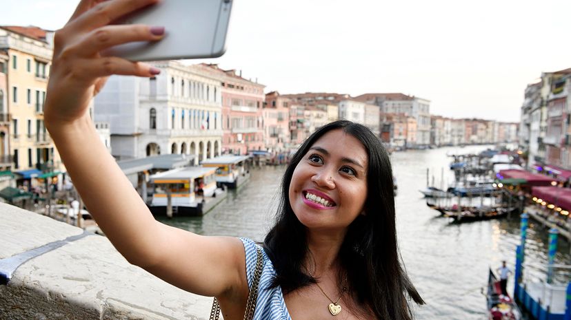 woman traveling solo selfie