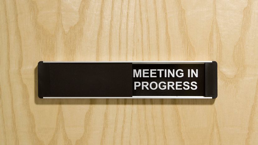 meeting in progress sign