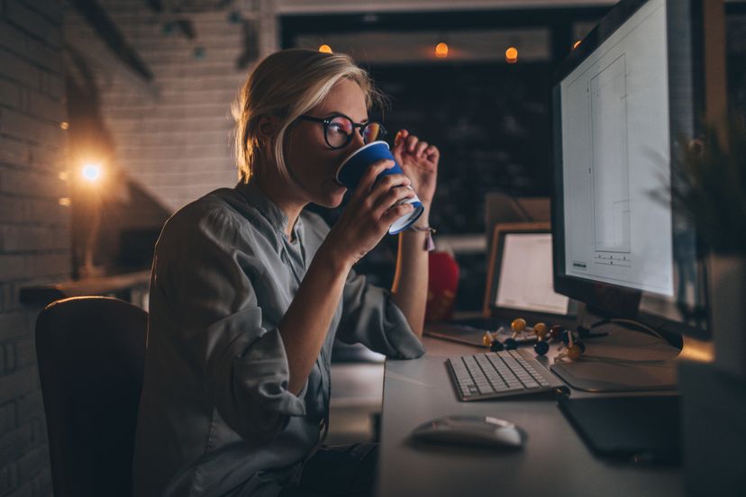 Photo of a woman working with Desktop