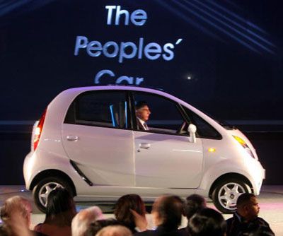 Chairman of the Tata Group, Ratan Tata drives the new Tata Nano car.