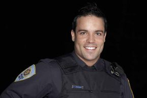 If a cop as cute as this came to your door, you too might be tempted to call 911 to get him to come back.