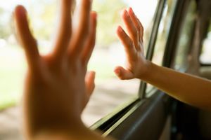 hands at car window