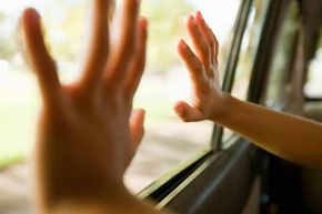 hands at car window