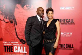 Halle Berry (R) poses with co-star Morris Chestnut at the premiere of &quot;The Call,&quot; a movie about a 911 dispatcher. See pictures of a day in the life of a police officer.