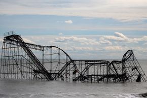 A roller coaster sits in the Atlantic Ocean after the Fun Town (New Jersey) pier it was built on on was destroyed by Superstorm Sandy.