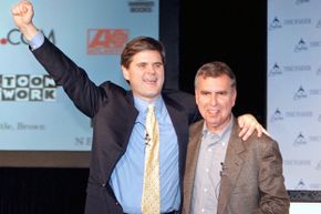 Steve Case, CEO of AOL (L) and Gerald Levin, CEO of Time Warner hug on January 10, 2000 in New York after announcing that AOL was acquiring Time Warner for $166 billion in stock.