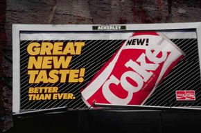 This billboard advertises the short-lived New Coke.
