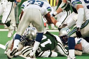 New York Jets quarterback Vinny Testaverde (green jersey) lies with his head on the goal line after being tackled by the Seattle Seahawks in 1998. The ref mistook his helmet for a ball and called a touchdown, giving victory to the undeserving Jets.