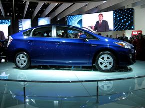 Image Gallery: Hybrid Cars The Toyota Prius shown here is a full hybrid that employs an electric motor run by batteries to reduce emissions caused by its internal combustion engine. See more hybrid car pictures.