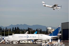 The Boeing 747 Dreamlifter hangs out at Paine Field Airport in Washington. See that aircraft flying above? That should give you an idea of just how massive a Dreamlifter is. Now imagine that giant landing unexpectedly on a modest runway.