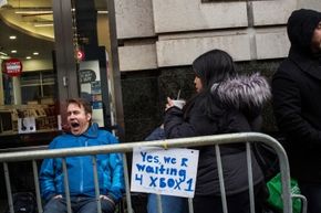 New Yorkers wait in line outside a Best Buy for the midnight release of the XBox One in November 2013.
