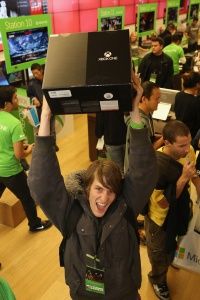 A fan in San Diego, Calif. shows off his purchase at a midnight release event.