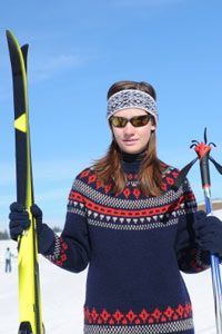 girl holding skis and poles