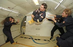 Playing catch with a fellow passenger in a low-gravity environment
