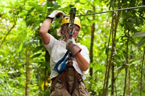 Person on a zip line in safety equipment