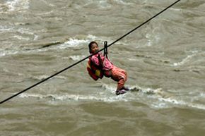 Yu Lina, a Chinese third grader, on a zip line