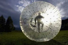 Person spinning alone in a circle outdoors.