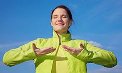 woman practicing breathing through yoga