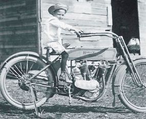 This little tyke is no doubt dreaming of the day when he can ride a motorcycle of his own.