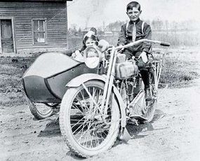 Fitted with a sidecar and passenger seat, motorcycles of the era often served as family transportation.