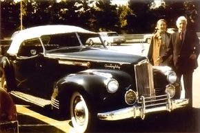  Dutch and his wife are shown here standing next to the Packard Darrin One Eighty.