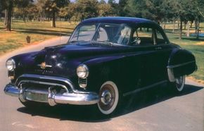 Styling on the 1950 Oldsmobile Series 76 was very similar to the 1949 model. See more classic car pictures.