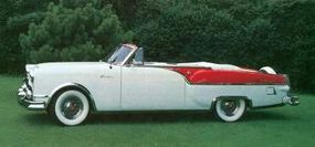 Two-tone paint and lowered rear-wheel cutoutsspruced up the 1954 model.