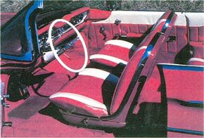 The 1960 Oldsmobile small Super 88 had flashy two-tone interior bucket seats and plenty of chrome trim.