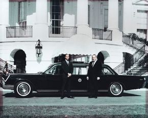 George Lehmann and Robert Peterson with presidential limousine