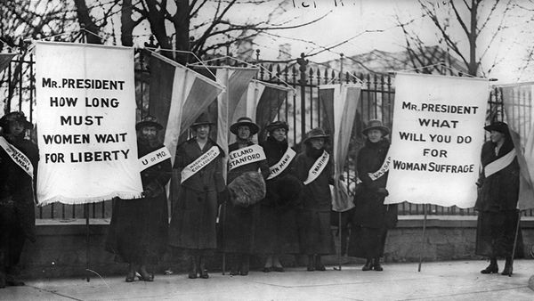 Men protest in black and white editorial sign.