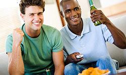 Guys on couch with beer