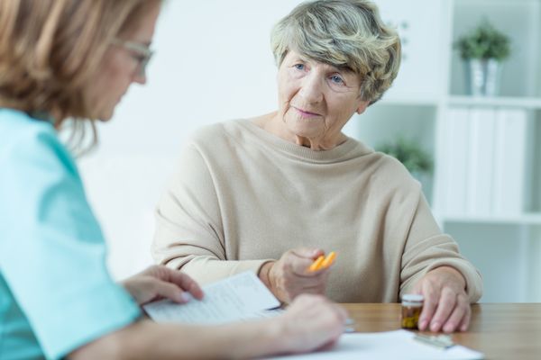 An elderly woman has a medical consultation.