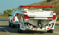 Car towing new boat