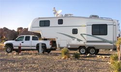 Truck with camper in desert