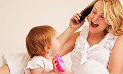 mom and baby playing with phones