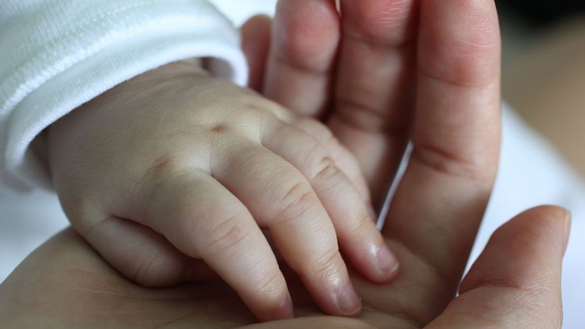 baby's hand in mother