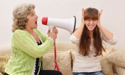 mother yelling at her teen daughter