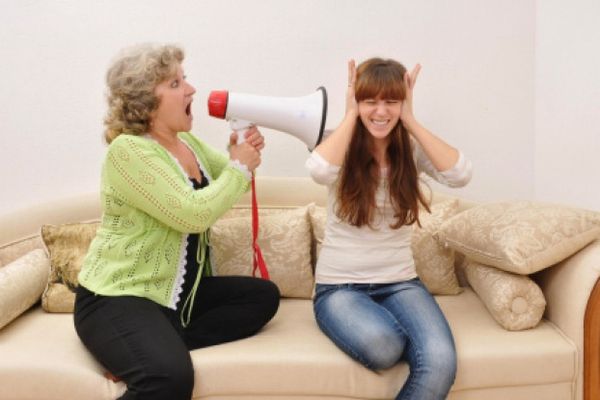 mother yelling at her teen daughter