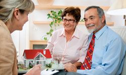 Real estate agent with older couple