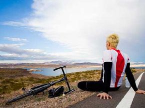 A road cyclist takes a break to check out the view of Lake Mead.