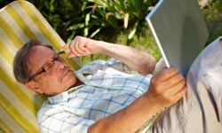 senior man using laptop outdoor