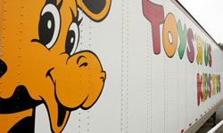 Geoffrey the Giraffe on a Toys "R" Us truck