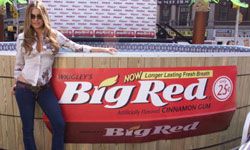 Carmen Electra next to Big Red ad