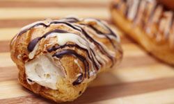 The famous French pastry is filled with cream and drizzled with chocolate.