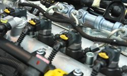 Why did fuel injection replace the carburetor?