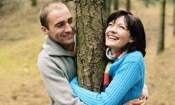 happy couple playing outside