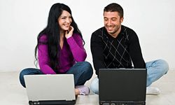 Couple with laptop computers