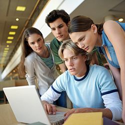 People crowded around computer