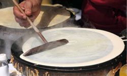 vendor preparing a crÃªpe